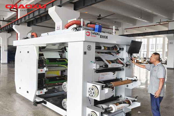 Operator standing in front of a stack press